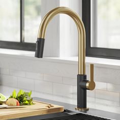 a kitchen sink with a cutting board next to it