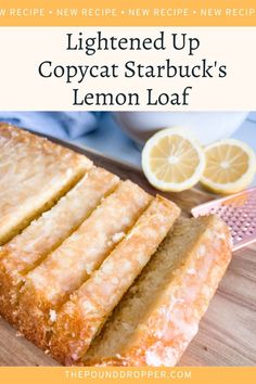 a loaf of lemonade bread on top of a cutting board next to sliced lemons