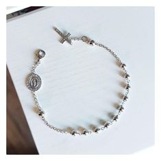 This beautiful rosary bracelet is made of sterling silver 925, with zircon cross and double sided Miraculous Medal encrusted with zircons. The specialty of this bracelet is in the fine details that make it perfect and shiny. This beautiful elegant bracelet is an ideal gift for catholic women on all occasions.  If you want to have a bracelet with a deeper meaning, this one is ideal for you Due to its simplicity, it can be worn every day and is easily combined with other jewelry. Item details:  Lenght of bracelet:  18 cm plus 1,5 cm  Width of bead :4  mm Weight of bracelet: 4,1 gr For any religious occasions. If you want to see the rest of our selection of beautiful bracelets, follow this link: https://www.etsy.com/shop/MedjugorjeJewelry?ref=shop_sections_curr&listing_id=1344945334§ion_id=40 Elegant Silver Cross Beaded Bracelets, Elegant Silver Beaded Cross Bracelets, Sterling Silver Spiritual Rosary Bracelet With Cross, Sterling Silver Cross Rosary Bracelet, Spiritual Sterling Silver Cross Rosary Bracelet, Elegant Sterling Silver Cross Rosary Bracelet, Silver Cross Rosary Bracelet, Adjustable Silver Cross Rosary Bracelet, Elegant Sterling Silver Crucifix Rosary