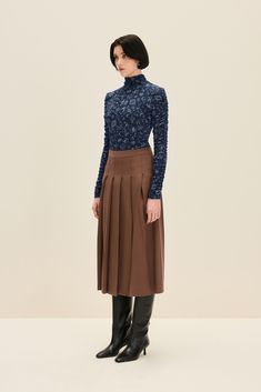 This navy blue top features an all-over Ballerina print with various motifs that add a touch of whimsy. The standout feature is the dramatic keyhole back, which adds a bold twist to the turtleneck silhouette. The long sleeves are ruched, adding texture and visual interest, making this top a versatile piece for both casual and dressy occasions. 96% Viscose, 4% Elastane  Hand wash or soft cycle wash Brown Midi Skirt, Ballerina Print, Tailored Skirt, Navy Print, Navy Blue Top, Gifts For New Mums, Long Sleeve Turtleneck, Pearl Jewellery Earrings, Blue Long Sleeve