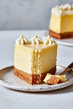 a slice of cheesecake on a plate with a fork