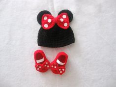 a crocheted hat and pair of baby shoes