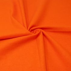 an orange fabric with very thin lines