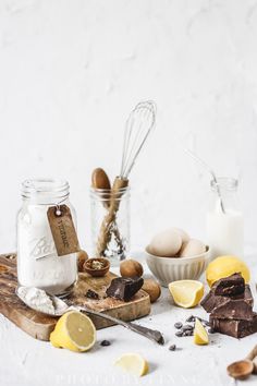 the ingredients for making chocolate lemonade are laid out on a cutting board and ready to be eaten