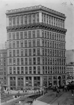 an old black and white photo of a large building