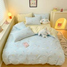 a bed room with a neatly made bed and stuffed animals on the pillowcases