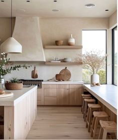 a kitchen filled with lots of counter top space next to a stove top oven and sink