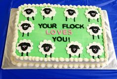 a sheet cake decorated with sheep and the words your flock loves you