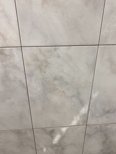 the tile is white and gray in color