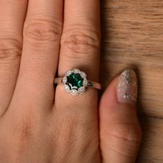 It is a lab emerald ring. The main stone is 7mm*7mm round cut, weight about 1.30 carats. The basic metal is sterling silver and plated with rhodium. To change the metal to a solid gold (white/rose) or platinum is also available, please ask for a quotation if you want. You can also go to my shop Home for more elegant rings: https://www.etsy.com/shop/godjewelry?ref=hdr_shop_menu More emerald rings: https://www.etsy.com/shop/godjewelry?ref=hdr_shop_menu§ion_id=20709240 Customization is always welco Rainbow Topaz Ring, Elegant Rings, May Birthstone Rings, Rainbow Topaz, Emerald Rings, June Birthstone Ring, Silver Engagement Ring, Spinel Ring, Sterling Silver Engagement Rings