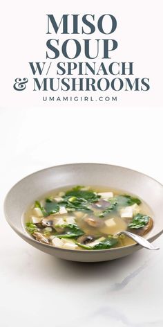 miso soup with spinach and mushrooms in a white bowl