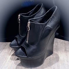 Versace High Heel Black Leather Wedge Booties - Size 9 , 39 Euro As Marked - Zip Front With Detailed Gold Zipper For Ease Of Getting On & Off - These Are Not Perfect , Look At Pics Closely .. One Larger Ding On Front Left Shoe Tip , Slight Insole In Front Starting To Lift , Light Scratches Throughout - Leather In Soft Condition Tops Of Shoes In Good Pre Luved Condition - Heels Measure 6” With A 2 1/2” Front Platform- True To Size - Very Balanced And Easy To Walk In For The Height ! Luxury Versac High Heel Black, Versace Shoes, Black High Heels, Gold Zipper, Not Perfect, Womens Shoes Wedges, Platform Wedges, Walk In, High Heel