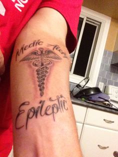 a person with a medical tattoo on their arm