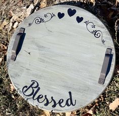 a wooden sign that says, besped with hearts on it in the grass