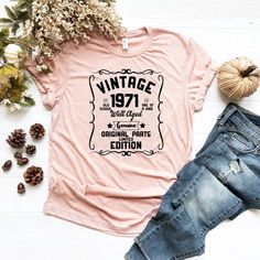 a pink t - shirt with the words vintage 1932 and an old fashion font on it