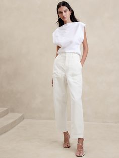 A fresh take on the classic utility pant, this vintage-inspired pair pairs back the utilitarian styling—the better to show off this beautiful fabric woven from organic cotton and luxurious linen.  High rise (11").  Relaxed fit though the thigh, tapered leg.  Ankle length.  Zip fly with book-and-bar closure.  Front and back pockets.  Unlined.  High rise (11").  Relaxed fit though the thigh, tapered leg.  Ankle length.  Ankle length.  Inseams: Short 24. 5", Regular 26. 5", Long 29. 5" Model: Size Cargo Outfit, White Midi Skirt, Cargo Pants Outfit, Mango Fashion, Banana Republic Pants, Luxury Linen, Cargo Pant, Bottom Clothes, Get The Look