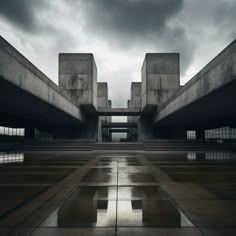 an empty concrete building with steps leading up to the top and sky in the background