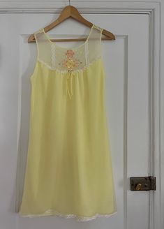 1970s yellow nightgown with floral embroidery 💐 Ruffled lace trim + bow 100% nylon Tag size L - est to fit M/L best but go by measurements below. Model is 5'2 34/27/38 for reference. Buyer is responsible for confirming fit and sales are final. If you have any questions please let me know before purchasing! CONDITION:  overall great vintage condition, a few faint pink spots on the back see pics MEASUREMENTS: (taken laying flat then doubled where applicable:) 36" long 36-38" pit to pit 38" waist Yellow Summer Nightgown, Spring Yellow Nightgown For Loungewear, Yellow Summer Nightgown For Sleep, Yellow Summer Sleep Dress, 1970s Nightgown, Yellow Nightgown, Pastel Lingerie, Women's Nightgowns, Pajama Robe