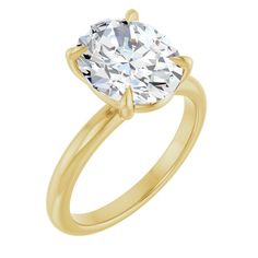 a yellow gold engagement ring with an oval cut diamond