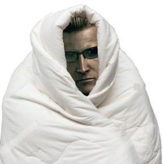 a man wearing sunglasses and a white blanket