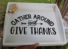 a white tray with the words gather around and give thanks written in black on it