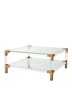 a glass and wood coffee table with two shelves