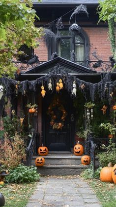 a house decorated for halloween with pumpkins and decorations