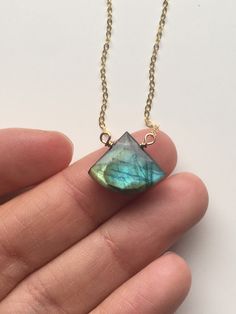 "Dainty 10x15mm Made to order Labradorite Pendant Necklace On 14K Gold Filled Or Sterling silver chain A flash of brilliance! That's a fitting definition for this unique labradorite necklace that shines in prismatic color. Beautiful facet cuts to highlight its stunning shades, this is a classic heirloom piece to be treasured for years to come. A stone you'll want to wear wherever life takes you. *if you would like a specific color please leave us a note - green - blue - we will try our best to a Faceted Labradorite Necklaces For Jewelry Making, Labradorite Gemstone Necklace As A Gift, Labradorite Gemstone Necklace For Gift, Labradorite Jewelry With Large Stone Gift, Faceted Labradorite Necklace For Gift, Selenite Necklace, Pink Pouch, Raw Crystal Necklace, Crystal Necklace Healing