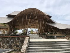 an outdoor pavilion with steps leading up to it