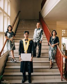 a group of people standing on some stairs