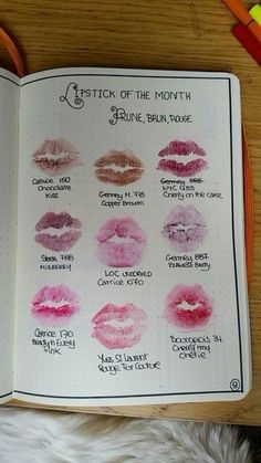 an open notebook with lipstick swatches on it and writing in the pages that says lipstick of the month