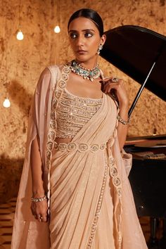 Pink pre-draped saree with in a textured fabric base and sequin embroidered border. Comes with embroidered border sheer cape, padded blouse and belt. - Aza Fashions Champagne Saree, Saree Cape, Saree With Cape, Blouse Organza, Organza Cape, Cape Set, Embroidered Belt, Vacuum Storage, Drape Saree