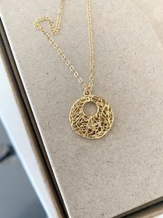 This beautifully detailed 24k gold plated filigree open circle pendant necklace is finished with delicate gold filled chain and a lobster clasp. The necklace is available in customizable lengths and is a great piece for a layered necklace combo. It's equally lovely on its own.  You may also like the coordinating earrings as picture in the 5th & 6th photos, link below. Please select you preferred necklace length from the drop down menu at check out.  The filigree pendant is approx 18x20mm. You may also like to check out the coordinating earrings and more of my filigree jewelry here: https://etsy.me/3REk4XO You may also like to check out more of my necklaces here: http://etsy.me/2kMdyB0 Free first class USPS shipping within the USA. Luxury Filigree Round Pendant Jewelry, Gold Necklaces With Delicate Open Circle Chain, Delicate Gold Wire Wrapped Necklaces, Delicate Gold Wire Wrapped Necklace, Delicate Gold Open Circle Necklace, Gold Open Circle Necklace For Gift, Gold Filigree Round Necklaces, Gold Filigree Round Necklace, Gold Wire Wrapped Jewelry In Circle Shape