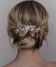 the back of a woman's head wearing a bridal hair comb