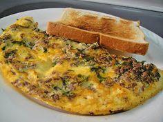 an omelet and toast on a white plate