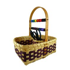 a basket that has scissors in it and some sort of handle on the handlebars