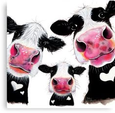 three black and white cows standing next to each other with hearts on their chests in front of them