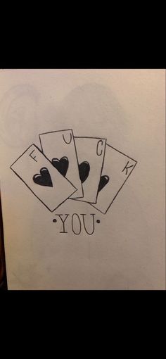 four playing cards with the word joy written in black ink on a piece of paper