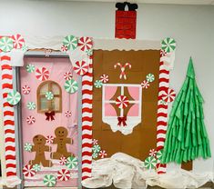 the front door is decorated with gingerbreads and candy canes