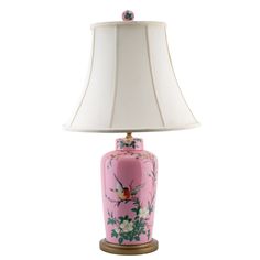 a pink and white lamp with a bird on it