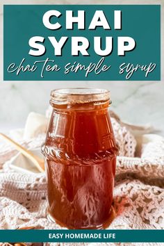 a jar filled with homemade chai syrup on top of a table