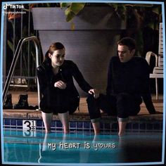 a man and woman standing in front of a swimming pool with the caption my heart is yours