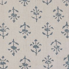 a blue and white fabric with small flowers on it