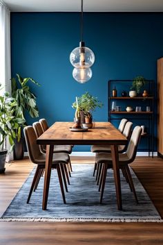 a dining room with blue walls and wooden table surrounded by chairs, potted plants and hanging lights