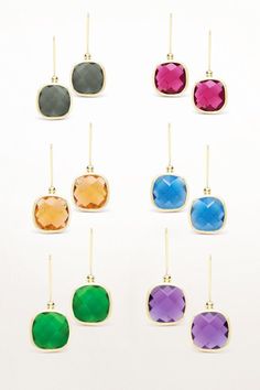 Discover the exquisite beauty of our Cushion Cut Gemstone Earrings, which offer a perfect blend of timeless charm and vibrant appeal. These earrings feature two cushion-cut gemstones carefully chosen for their exceptional color and brilliance. Each gemstone boasts a unique hue that radiates vitality, ranging from rich blues and greens to fiery reds and warm oranges. The gemstones are in a golden frame that is secure and stylish, showcasing their captivating charm. The frame's sleek and smooth li Golden Frame, Indian Embroidery, Fashion Marketing, Fiery Red, Smooth Lines, Sea Green, Cushion Cut, Gemstone Earrings, Timeless Beauty