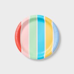 a paper plate with multicolored stripes on it