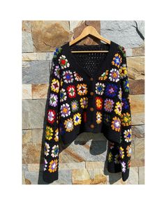 Black Granny Square Crochet Cardigan, Granny Square Cardigan, Women's Crocheted Cardigan, Long Sleeves Crochet Cardigan ✅This Cardigan you can wear at dating, shopping, vacation, work, leisure, party, daily wear, and other occasions that will make you look attractive. This loose cardigan sweaters will become essential trendy cardigans this season. Exquisite sweaters with cute scarves or beautiful necklaces will make you more eye-catching, become the focus of the crowd, and gain compliments from Black Long Sleeve Granny Square Cardigan, Bohemian Black Cardigan With Granny Square, Black Bohemian Cardigan With Granny Square Details, Black Bohemian Cardigan With Granny Square, Black Bohemian Crochet Cardigan, Fall Crochet V-neck Cardigan, Handmade Black Sweater For Spring, Black Granny Square Sweater For Fall, Black Sweater With Granny Square For Fall