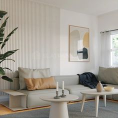 a living room filled with furniture and a potted plant