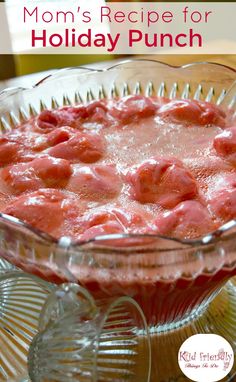 a glass dish filled with food on top of a wooden table and text overlay reads mom's recipe for holiday punch