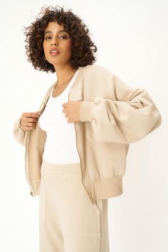 You're realllly going to love Rhyna.The Rhyna Zip Up Pocket Jacket will soon be your new go-to. This bomber jacket silhouette is comfortably relaxed, made of a heavyweight French terry that makes for easy layering. Balloon sleeves, snap details, drop shoulders, contrast rib bands, raw edges throughout, and chest pocket details... I mean, need we go on? Style this perfect piece with the matching Take A Bow Tie Bottom Parachute Pant. 70% Cotton30% Rayon Care Instructions: Machine wash cold. Wash i Parachute Pant, Cami Bra, Oversize Sleeves, Straight Dress, Pocket Jacket, Cropped Cami, Balloon Sleeves, Ribbed Fabric, Hazelnut